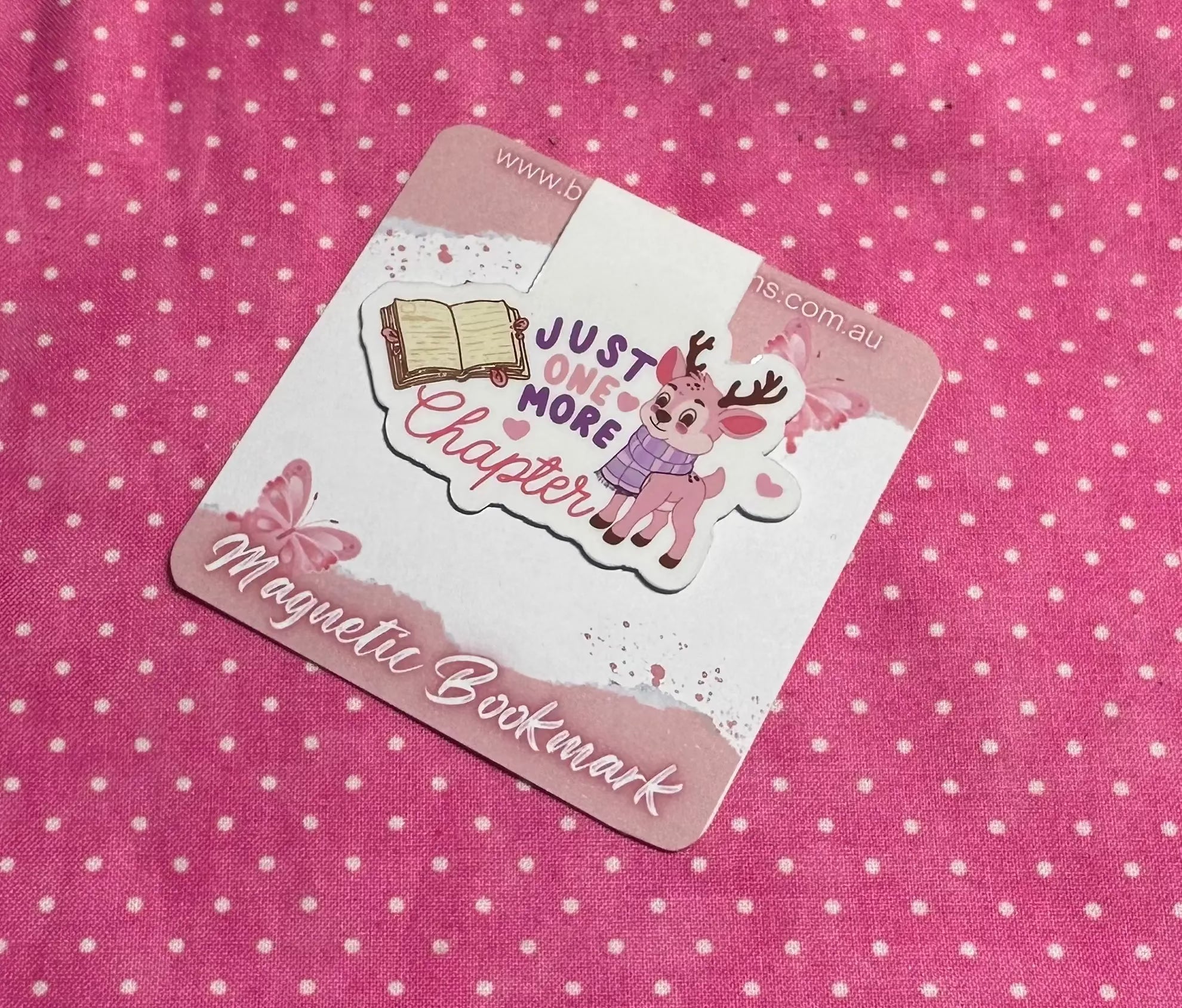 Magnetic bookmark with cartoon deer and text on a pink polka dot background
