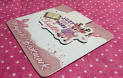 Magnetic bookmark with cartoon design on a pink polka dot background