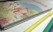 Lisa Lamb Fabric Notebook scene side of cover closed view