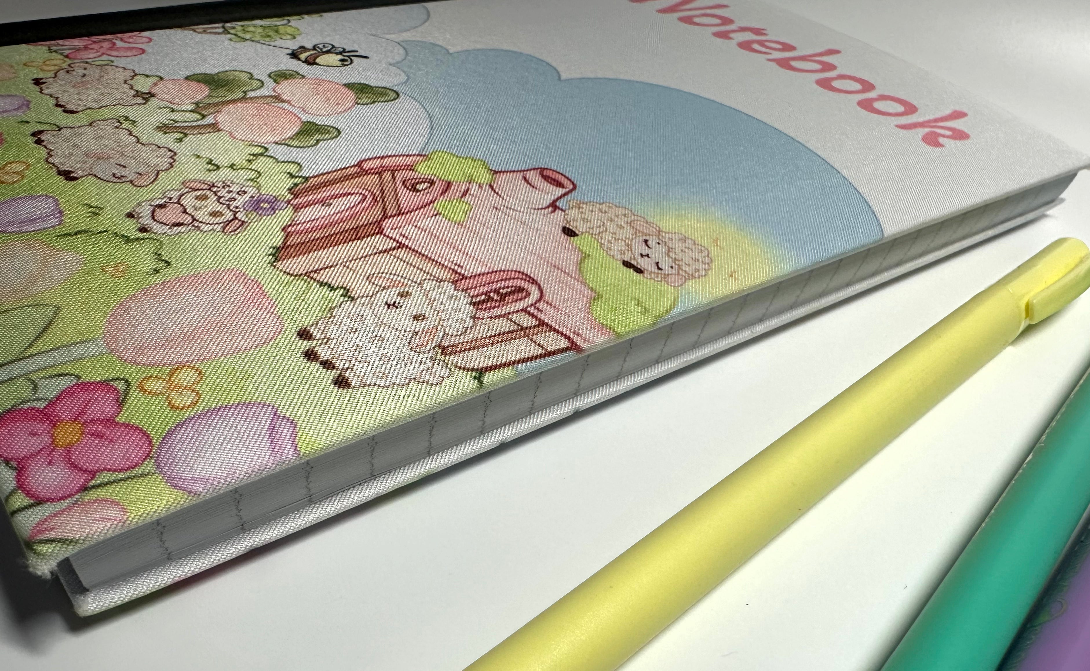 Lisa Lamb Fabric Notebook scene side of cover closed view