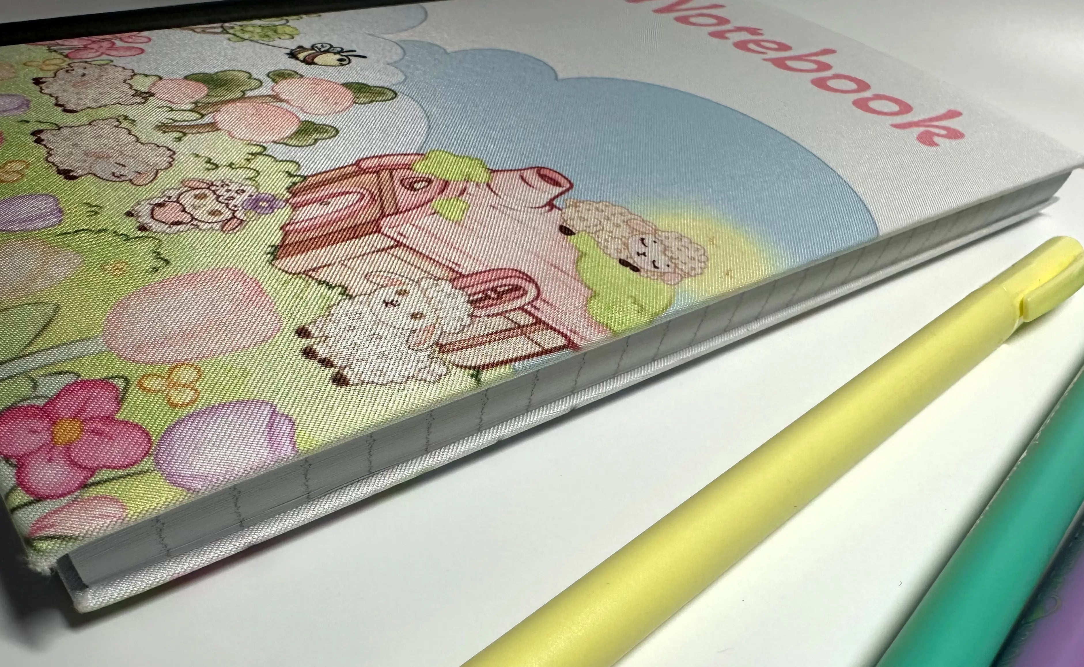 Lisa Lamb Fabric Notebook scene side of cover closed view